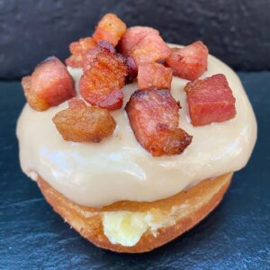 Dad Bod Doughnut -Whiskey cream filling with maple whiskey glaze topped with Nueske Bacon